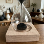 Magnetic Sand Hourglass Sculpture - Wood Base finish, flipped mid-flow