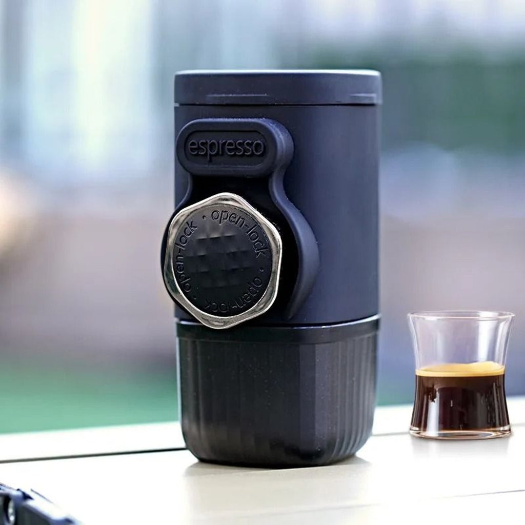 Portable hand-press espresso maker with built-in cup