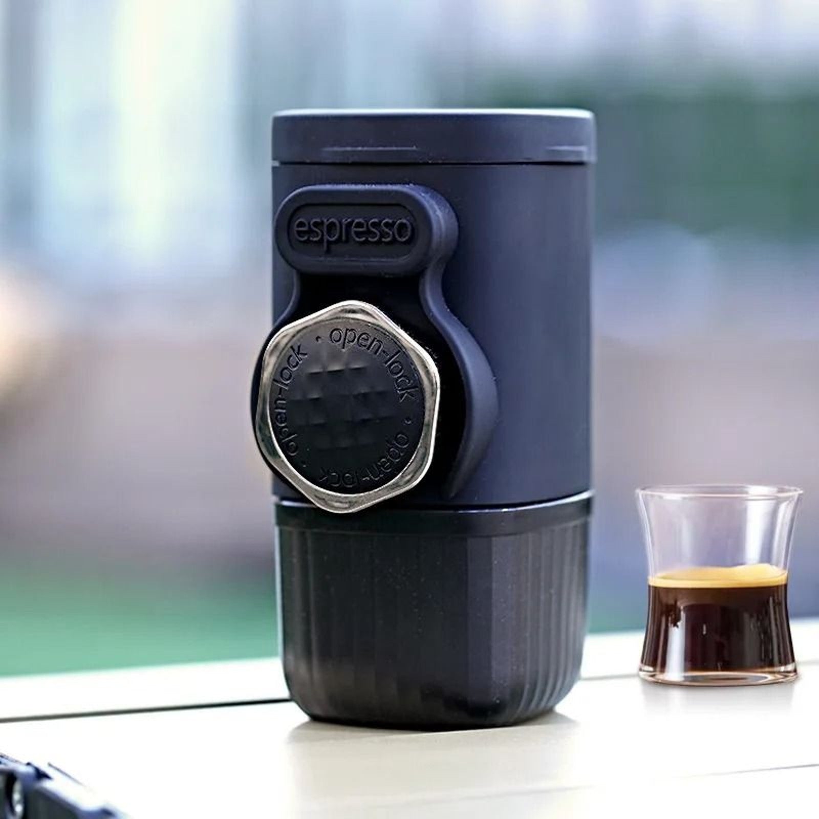 Portable hand-press espresso maker with built-in cup
