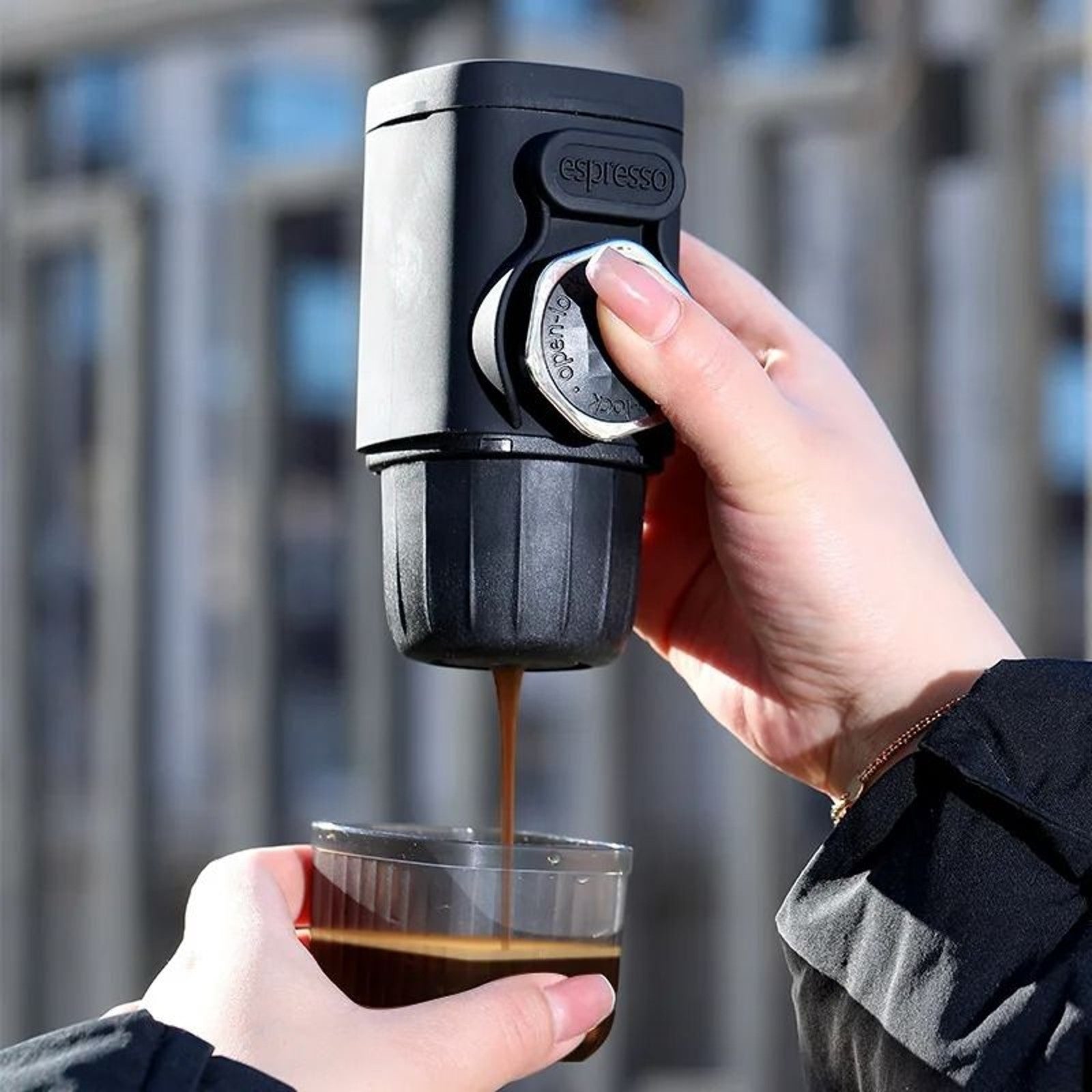 Portable hand-press espresso maker with built-in cup